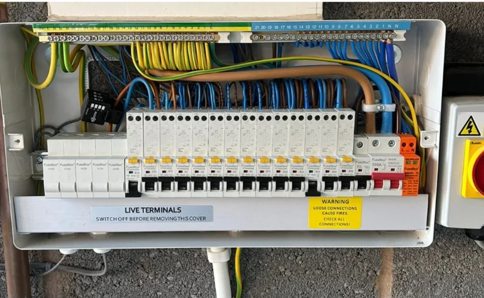 Consumer unit fitted with a full row of RCBOs, labelled and ready for inspection