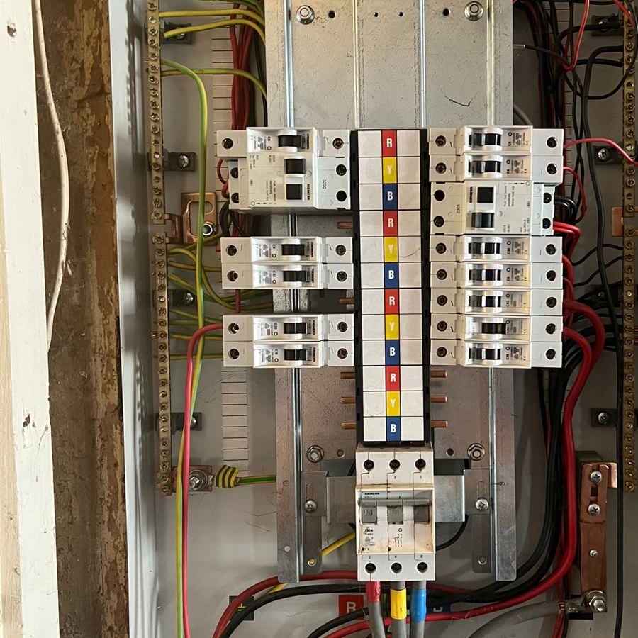 Three-phase distribution board wiring during a commercial electrical upgrade